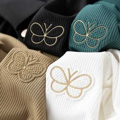 Classic Textured Polo Shirt with Elegant Butterfly Embroidery