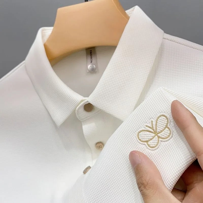 Elegant Textured Polo Shirt with Embroidered Butterfly Logo